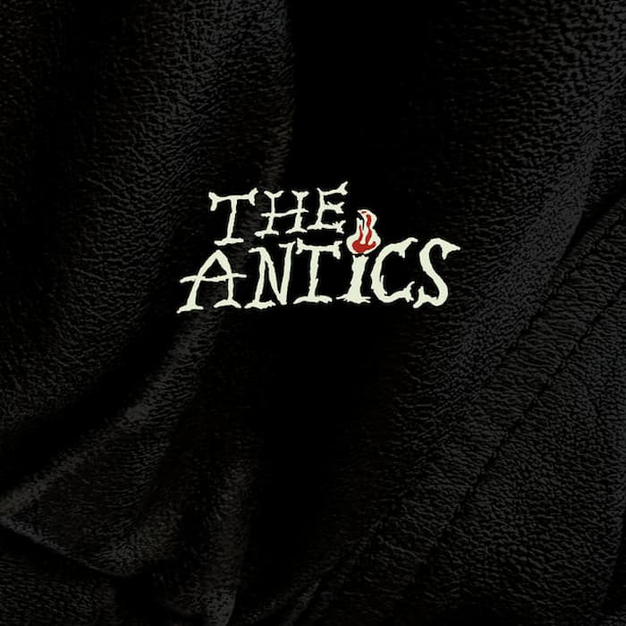 The Antics – self-titled clear vinyl LP front cover, black textured sleeve with embroidered-style band logo and red flame detail