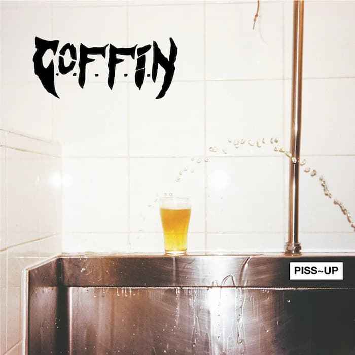 Album cover art for Coffin's 'Piss-Up', featuring a glass of beer on a stainless steel sink with water spraying, set against a white tiled wall with the band's logo in black at the top left.