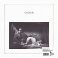 Album cover for Joy Division's 'Closer', featuring a black and white classical painting of a reclining figure, with the title 'CLOSER' at the top and a barcode label at the bottom right.