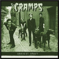 The Cramps 'Gravest Gravey' album cover, featuring the band members and their dogs in a sepia-toned outdoor alleyway.