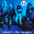 Album cover with a band posing and 'L7' logo, text 'smell the magic' on blue background