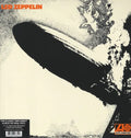 Album cover with a black airplane silhouette on a beige background, featuring the text 'Led Zeppelin' at the top.