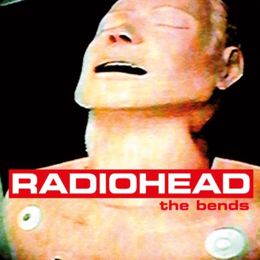 Album cover for Radiohead's 'The Bends' featuring a close-up of a person with a black background.