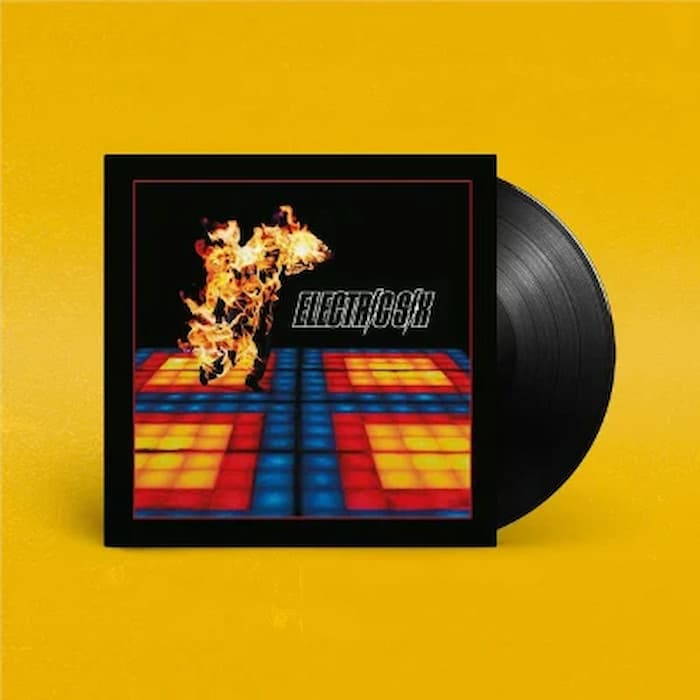 Electric Six vinyl record album with the black LP partially visible behind the square album cover, set against a solid yellow background.