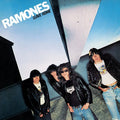 Album cover for 'Leave Home' by Ramones featuring four band members.