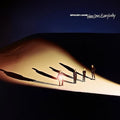 Album cover art for Spacey Jane's 'Here Lies Everybody', featuring three figures standing on a brightly lit sand dune under a dark blue sky, casting long shadows. The band's name and album title are printed in white at the top right.