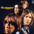 Album cover for 'the stooges' featuring four band members with a dark background.